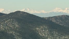 HD stock footage aerial video of mountains with trees and light snow in the Rocky Mountains, Colorado Aerial Stock Footage | HDA13_302