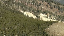 HD stock footage aerial video of a snowy slope and evergreen forest in the Rocky Mountains, Colorado Aerial Stock Footage | HDA13_327