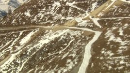 HD aerial stock footage video of following a road up a slope in the Rocky Mountains, Colorado Aerial Stock Footage | HDA13_364