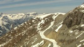 HD stock footage aerial video follow a snowy path on a slope in the Rocky Mountains, Colorado Aerial Stock Footage | HDA13_365