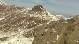 HD stock footage aerial video of flying over mountain toward a rocky protrusion in the Rocky Mountains, Colorado Aerial Stock Footage | HDA13_375_01