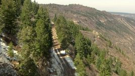 HD stock footage aerial video follow a mountain road to a fork in the Rocky Mountains, Colorado Aerial Stock Footage | HDA13_383
