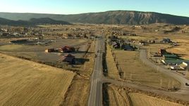 HD stock footage aerial video of flying over fields and grazing animals on the way to Ridgway, Colorado at sunset Aerial Stock Footage | HDA13_395_02