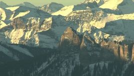HD stock footage aerial video of jagged peaks with snow at sunrise in the Rocky Mountains, Colorado Aerial Stock Footage | HDA13_410