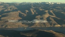 HD stock footage aerial video of flying by the Blue Mesa Reservoir and Rocky Mountains at sunrise, Colorado Aerial Stock Footage | HDA13_416