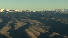 HD stock footage aerial video of rounded and snowy Rocky Mountains at sunrise, Colorado Aerial Stock Footage | HDA13_420