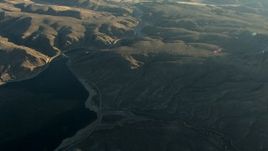 HD stock footage aerial video tilt from the Blue Mesa Reservoir at sunrise to reveal the town of Gunnison, Colorado Aerial Stock Footage | HDA13_421