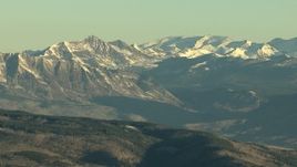 HD aerial stock footage video of Rocky Mountains capped with snow at sunrise, Colorado Aerial Stock Footage | HDA13_423