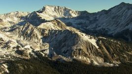 HD stock footage aerial video of flying by snowy ridges at sunrise, Rocky Mountains, Colorado Aerial Stock Footage | HDA13_448
