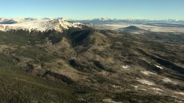 HD stock footage aerial video of passing snowy mountains at sunrise near Park County, Rocky Mountains, Colorado Aerial Stock Footage | HDA13_456