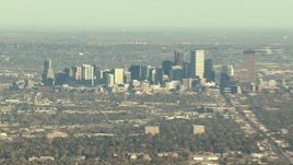HD stock footage aerial video of skyscrapers in Downtown Denver, zoom to reveal suburbs, Colorado Aerial Stock Footage | HDA13_485_01