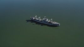 5K aerial stock footage tilt from Suisun Bay, reveal National Defense Reserve Fleet warship, Suisun Bay, California Aerial Stock Footage | JDC01_039