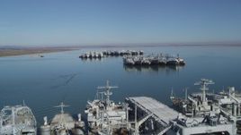 5K aerial stock footage tilt from Suisun Bay, reveal National Defense Reserve Fleet warships, Suisun Bay, California Aerial Stock Footage | JDC01_041