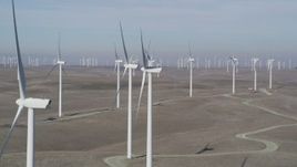 5K aerial stock footage of flying by field of windmills, Shiloh Wind Power Plant, Montezuma Hills, California Aerial Stock Footage | JDC01_068
