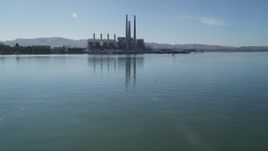 5K aerial stock footage tilt up from water, revealing Pittsburg power plant and smoke stacks, Pittsburg, California Aerial Stock Footage | JDC01_082