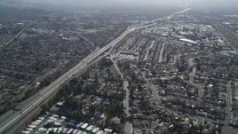 5K aerial stock footage of flying by a freeway and suburban neighborhoods, Concord, California Aerial Stock Footage | JDC01_089