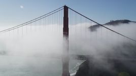 5K aerial stock footage of flying by the iconic Golden Gate Bridge, shrouded in thick fog, San Francisco, California Aerial Stock Footage | JDC02_015