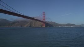 5K aerial stock footage of flying low over the Bay, under the iconic Golden Gate Bridge, San Francisco, California Aerial Stock Footage | JDC02_030