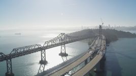 5K aerial stock footage of flying by the Bay Bridge, new span under construction, San Francisco, California Aerial Stock Footage | JDC02_045