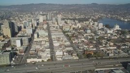 5K aerial stock footage of flying by the city's office buildings and Lake Merritt, Downtown Oakland, California Aerial Stock Footage | JDC02_050