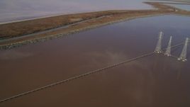 5K aerial stock footage of flying by power lines and Mowry Slough marshlands, Newark, California Aerial Stock Footage | JDC03_006