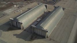 5K aerial stock footage tilt to reveal Hangar Two, Hangar Three at Moffett Field military base, Mountain View, California Aerial Stock Footage | JDC03_021