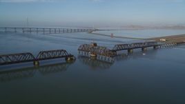 5K aerial stock footage of flying by a railroad bridge, Dumbarton Bridge, San Francisco Bay, California Aerial Stock Footage | JDC04_034