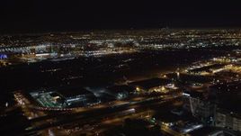 5K aerial stock footage track a passenger jet landing at night, LAX (Los Angeles International Airport), California Aerial Stock Footage | LD01_0006