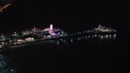 5K aerial stock footage orbit around Santa Monica Pier, California at night Aerial Stock Footage | LD01_0032