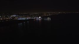 5K aerial stock footage an approach to Santa Monica Pier, California at night Aerial Stock Footage | LD01_0038