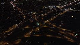 5K aerial stock footage pan across freeway at night to reveal interchange, West Los Angeles, California Aerial Stock Footage | LD01_0044