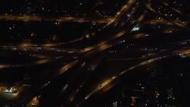5K aerial stock footage orbit of a freeway interchange at night in West Los Angeles, California Aerial Stock Footage | LD01_0047