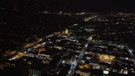 5K aerial stock footage flying toward the Beverly Hills Police Department at night, California Aerial Stock Footage | LD01_0060