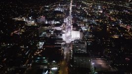 5K aerial stock footage approach hotels and theaters at night in Hollywood, California Aerial Stock Footage | LD01_0070