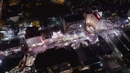 5K aerial stock footage flyby hotels and theaters at night in Hollywood, California Aerial Stock Footage | LD01_0071