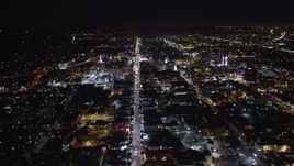 5K aerial stock footage tilt from hotels and theaters up Hollywood Boulevard at night, Hollywood, California Aerial Stock Footage | LD01_0074