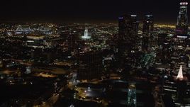 5K aerial stock footage of city hall, and reveal skyscrapers at night in Downtown Los Angeles, California Aerial Stock Footage | LD01_0075
