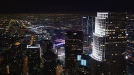 5K aerial stock footage fly over skyscrapers to approach Staples Center at night Downtown Los Angeles, California Aerial Stock Footage | LD01_0080
