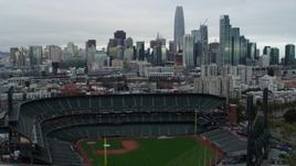 5.7K stock footage aerial video of ascending near AT&T Park baseball stadium and pan to city skyline, Downtown San Francisco, California Aerial Stock Footage | PP0002_000001