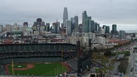 5.7K stock footage aerial video descend near AT&T Park and tilt to reveal city skyline in background, Downtown San Francisco, California Aerial Stock Footage | PP0002_000020