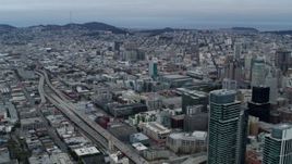 5.7K stock footage aerial video pan from the expanse of the city to skyscrapers, Downtown San Francisco, California Aerial Stock Footage | PP0002_000045