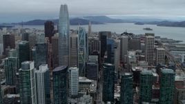 5.7K stock footage aerial video pan across tall skyscrapers to reveal the Bay Bridge, Downtown San Francisco, California Aerial Stock Footage | PP0002_000046