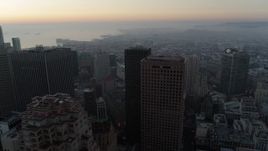5.7K stock footage aerial video ascend and pan across skyscrapers at sunrise in Downtown San Francisco, California Aerial Stock Footage | PP0002_000049