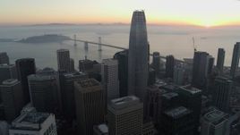5.7K stock footage aerial video reverse view of Salesforce Tower and skyscrapers at sunrise in Downtown San Francisco, California Aerial Stock Footage | PP0002_000055