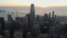 5.7K stock footage aerial video fly away from Salesforce Tower and skyscrapers at sunrise in Downtown San Francisco, California Aerial Stock Footage | PP0002_000056