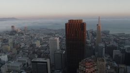 5.7K stock footage aerial video of fog over the bay behind city skyscrapers in Downtown San Francisco, California Aerial Stock Footage | PP0002_000071