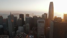 5.7K stock footage aerial video pan from Salesforce Tower to reveal skyscraper at sunrise, Downtown San Francisco, California Aerial Stock Footage | PP0002_000079