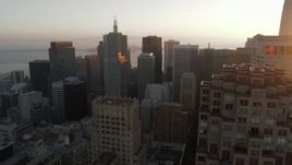 5.7K stock footage aerial video pan across skyscrapers at sunrise before descending, Downtown San Francisco, California Aerial Stock Footage | PP0002_000081