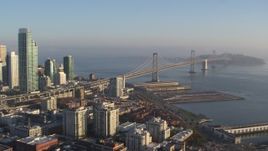5.7K stock footage aerial video pan from the Bay Bridge to reveal skyline of Downtown San Francisco, California Aerial Stock Footage | PP0002_000087