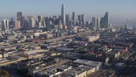 5.7K stock footage aerial video pan from South of Market train station and approach skyline, Downtown San Francisco, California Aerial Stock Footage | PP0002_000098